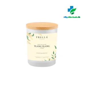 A lit Frella Aromatherapy Candle with Ylang Ylang Essential Oil, made with beeswax to soothe and calm.